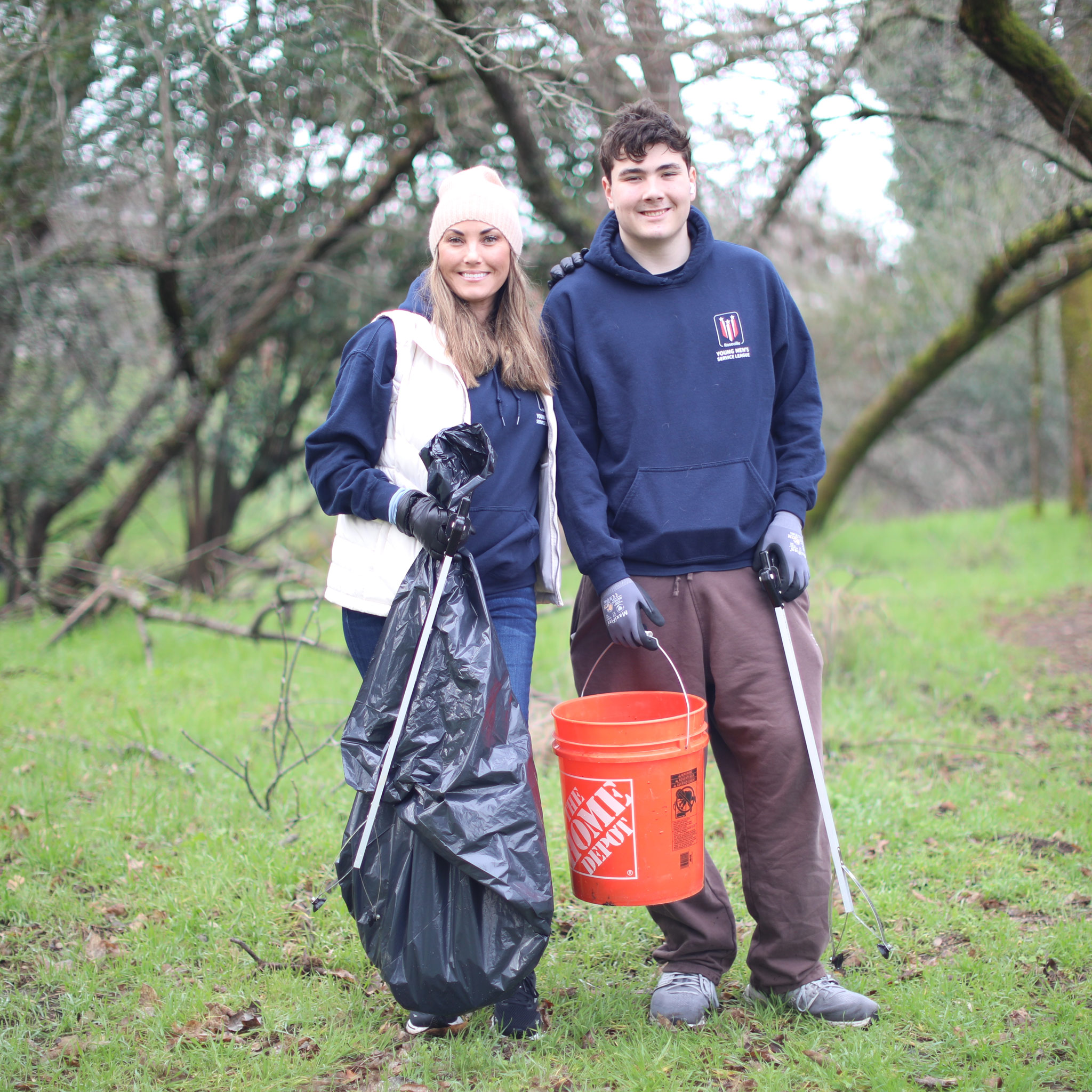 Mom and son cleaning a creek